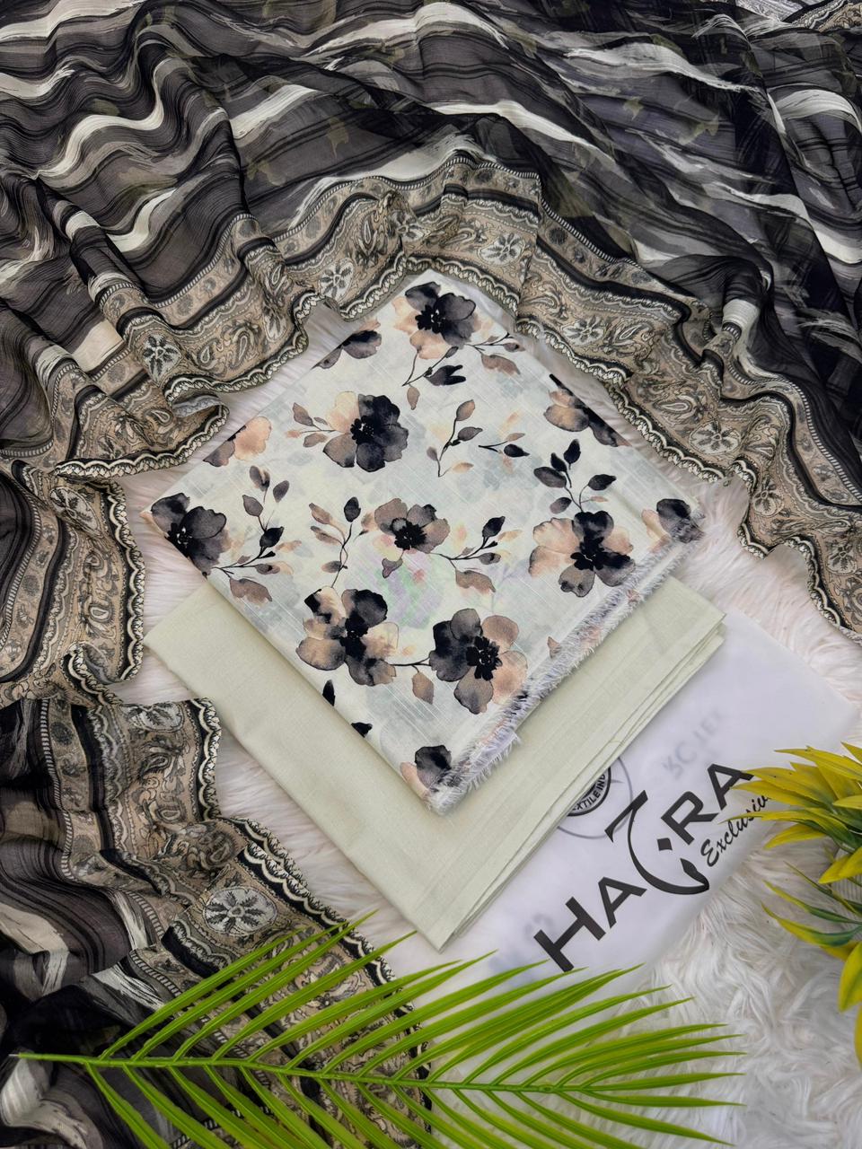 Aladeen Fabrics Hajra Exclusive off white printed lawn suit with green floral design and Bamber dupatta