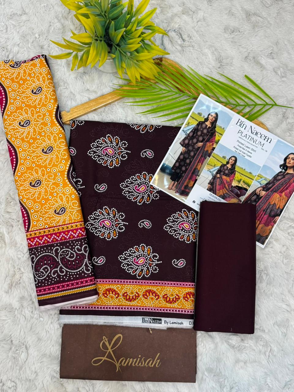 Bin Naeem Platinum maroon and mustard yellow floral printed lawn suit with pink accents and white outline floral design for women