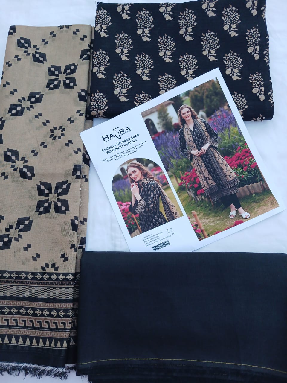 Professional flat lay of shirt, trouser, and dupatta pieces.