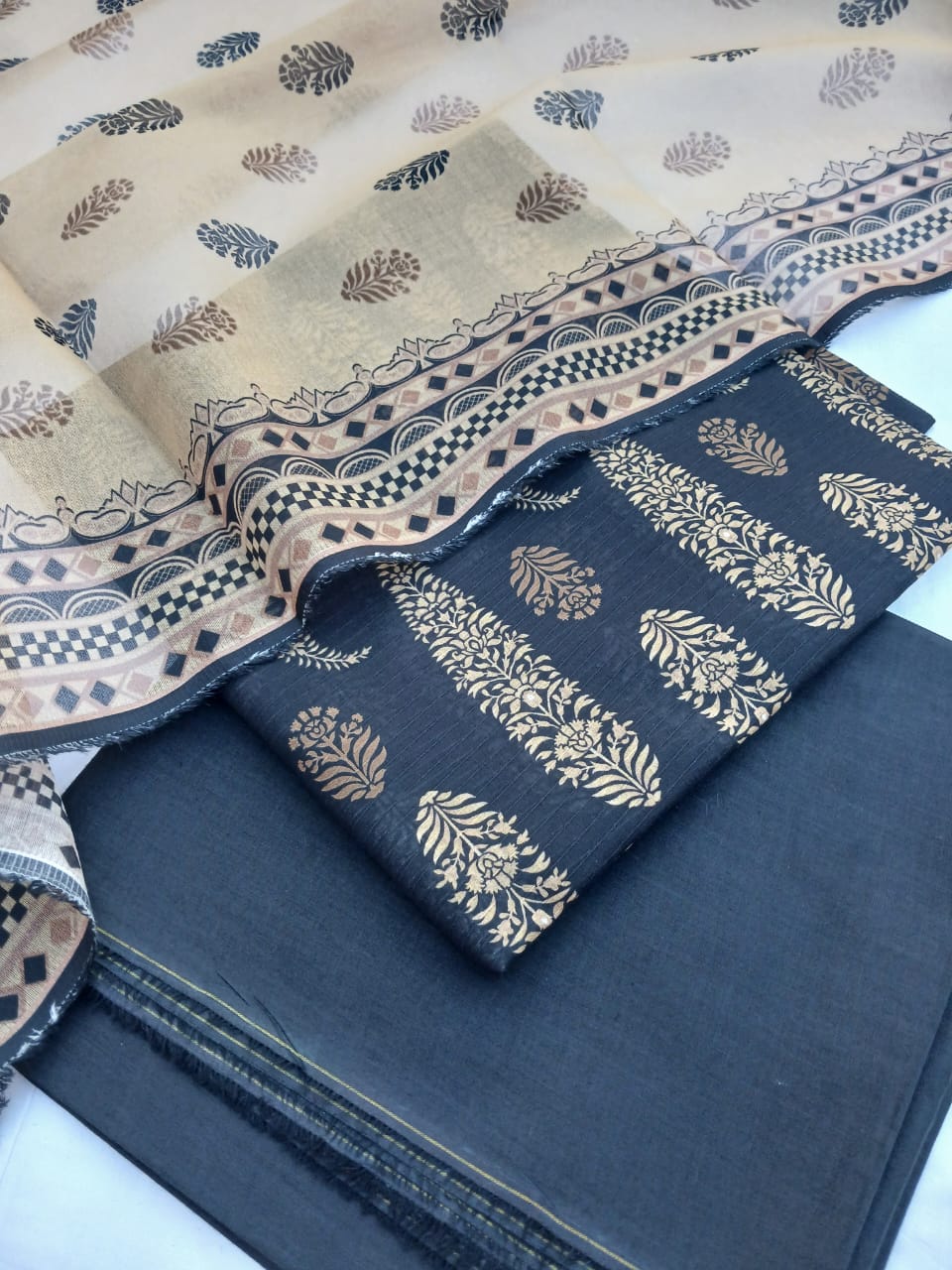 Close-up of the intricate digital print border on the lawn suit.