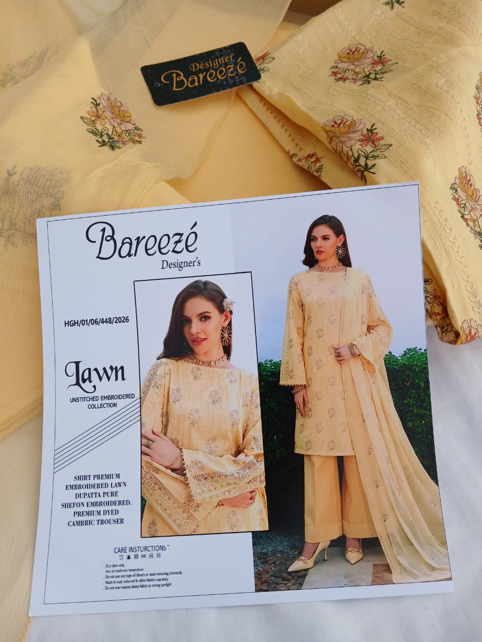 Cream embroidered lawn suit with elegant floral embroidery and embroidered Bamber dupatta for women by Aladeen Fabrics