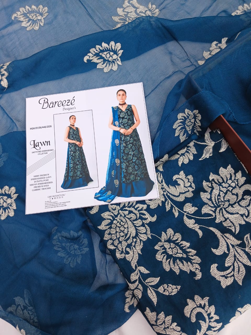 Floral embroidery detailing on luxury blue lawn fabric for ladies