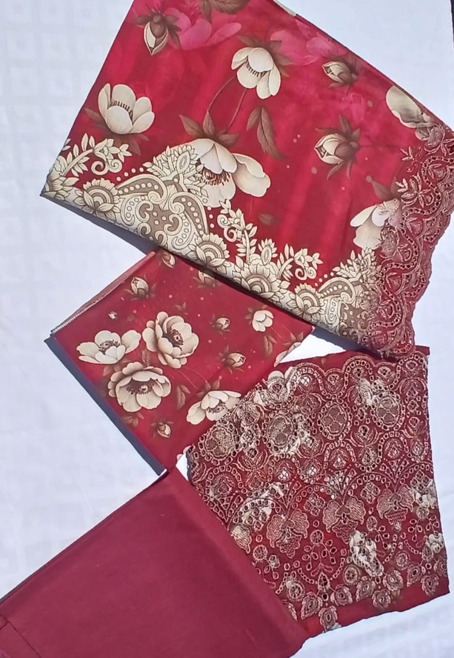 Complete three piece burgundy embroidered lawn suit with digital printed dupatta and cambric trousers