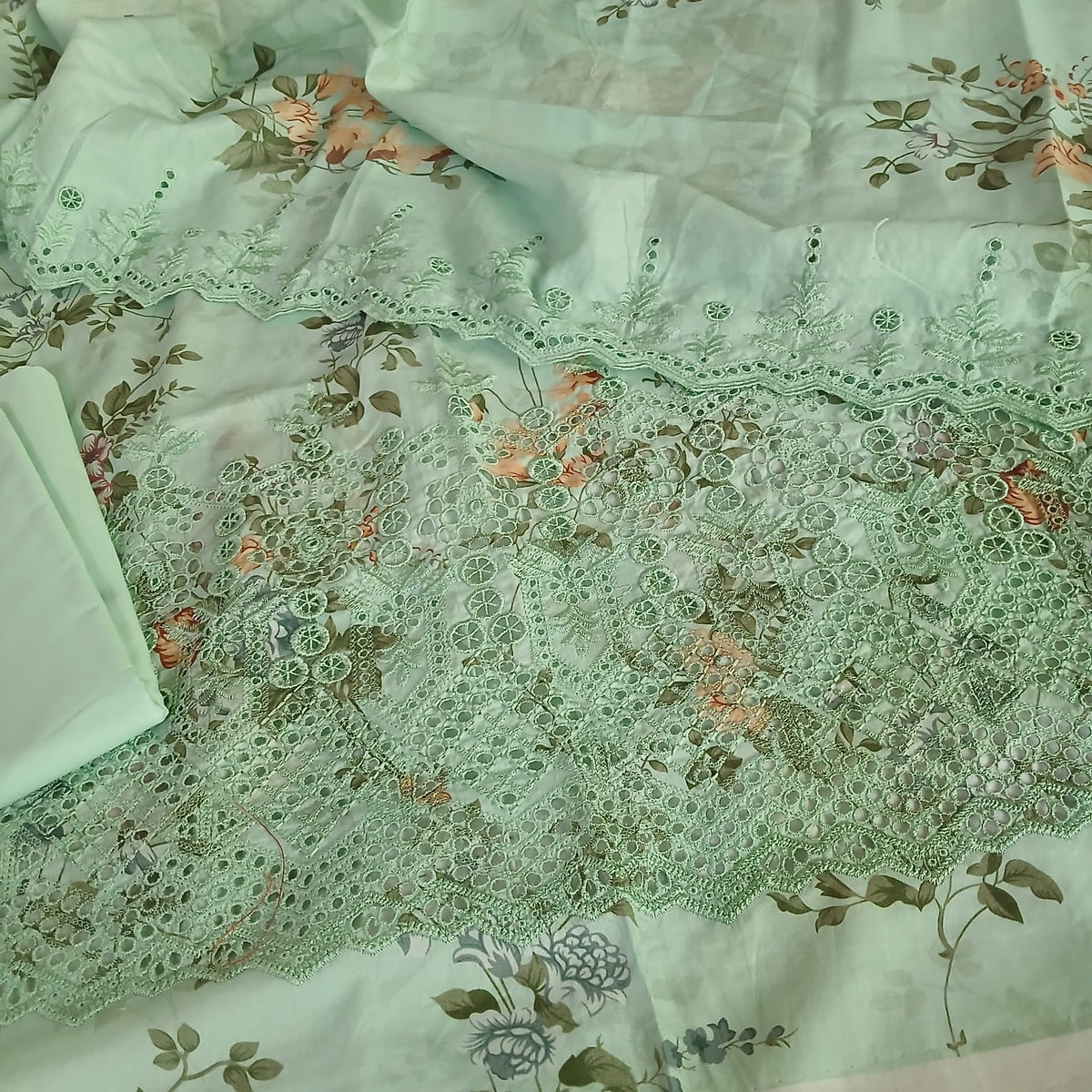 Pastel green lawn suit with full front embroidery and cutwork detailing premium summer wear design