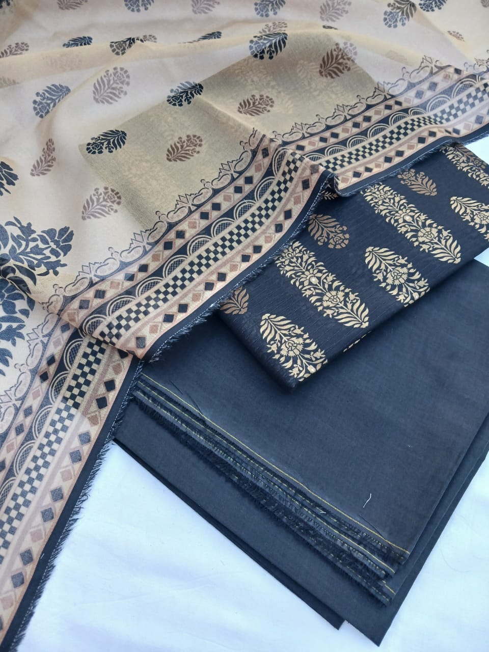 Full view of 3-piece black floral lawn suit by Aladeen Fabrics.
